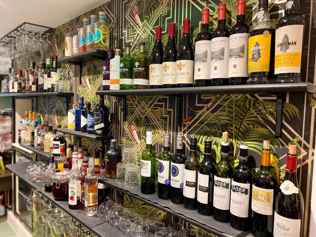 The Lion At West Pennard Otel Dış mekan fotoğraf A selection of wine and spirits at the bar
